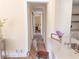 Bright hallway with hardwood floors, leading to bedrooms and other areas of the home at 1912 Canmont Ne Dr, Atlanta, GA 30319