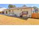 Updated house exterior with a large backyard and deck at 1912 Canmont Ne Dr, Atlanta, GA 30319