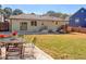 Updated house exterior with a large backyard and deck at 1912 Canmont Ne Dr, Atlanta, GA 30319