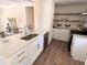 Modern kitchen with white shaker cabinets, quartz countertops, and stainless steel appliances at 1912 Canmont Ne Dr, Atlanta, GA 30319