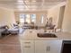 Modern kitchen flows into the open living area with hardwood floors at 1912 Canmont Ne Dr, Atlanta, GA 30319