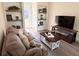 Living room with hardwood floors, built-in shelving and a cozy seating area at 1912 Canmont Ne Dr, Atlanta, GA 30319