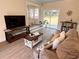 Spacious living room with hardwood floors, sliding glass doors to backyard at 1912 Canmont Ne Dr, Atlanta, GA 30319