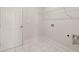 Convenient laundry room with shelving and tile floors at 64 Parkview Dr, Dallas, GA 30157
