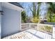 A back deck with white railings overlooks a fenced backyard at 1156 Tucker Sw Pl, Atlanta, GA 30310