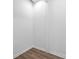 Empty, clean, and bright basement with vinyl wood flooring at 1156 Tucker Sw Pl, Atlanta, GA 30310