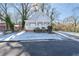 Gray house with white porch and snow-covered lawn at 1156 Tucker Sw Pl, Atlanta, GA 30310