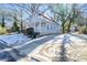 Light gray house with a front porch and driveway at 1156 Tucker Sw Pl, Atlanta, GA 30310