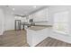 Modern kitchen with white cabinets, granite counters, and stainless steel appliances at 1156 Tucker Sw Pl, Atlanta, GA 30310