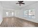 Open living room with hardwood floors and lots of light at 1156 Tucker Sw Pl, Atlanta, GA 30310