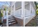 Front porch with white railings and brick steps at 1156 Tucker Sw Pl, Atlanta, GA 30310
