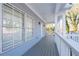 Front porch with white railings and view of the yard at 1156 Tucker Sw Pl, Atlanta, GA 30310