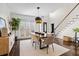 Bright dining room with hardwood floors and a large wooden table at 1160 Lea Dr, Roswell, GA 30076