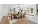 Modern farmhouse dining room with hardwood floors and a rustic wooden table at 510 Watergate Ct, Roswell, GA 30076