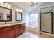 Elegant main bathroom with dual vanities, a soaking tub, and a walk-in shower at 1783 Chasewood Park Ln, Marietta, GA 30066