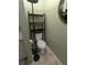 Small bathroom with toilet and shelving unit at 21 Muncy Se Ct, Smyrna, GA 30080