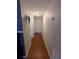 Light and bright hallway with wood-look flooring at 21 Muncy Se Ct, Smyrna, GA 30080
