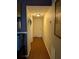 Hallway with wood-look flooring and artwork at 21 Muncy Se Ct, Smyrna, GA 30080