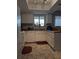 Bright eat-in kitchen with white cabinets and tile floors at 21 Muncy Se Ct, Smyrna, GA 30080