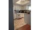 Bright eat-in kitchen with white cabinets and tile floors at 21 Muncy Se Ct, Smyrna, GA 30080