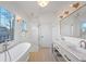 Elegant bathroom with double vanity, soaking tub, and walk-in shower at 731 Belt Se Loop, Atlanta, GA 30316