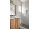 Modern bathroom with a walk-in shower, light wood vanity, and subway tile at 731 Belt Se Loop, Atlanta, GA 30316