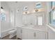 Elegant bathroom with white double vanity, white subway tile, and a bathtub at 731 Belt Se Loop, Atlanta, GA 30316