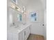Spa-like bathroom with double vanity, quartz countertop and large mirror at 731 Belt Se Loop, Atlanta, GA 30316