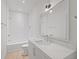 Modern bathroom with white subway tile, quartz countertop, and a soaking tub at 731 Belt Se Loop, Atlanta, GA 30316