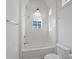 Clean bathroom with white subway tile, a bathtub and shower combination at 731 Belt Se Loop, Atlanta, GA 30316