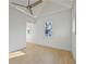 Bright bedroom with hardwood floors, ceiling fan, and large windows at 731 Belt Se Loop, Atlanta, GA 30316