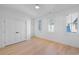 Spacious bedroom with hardwood floors, bright white walls, and double doors at 731 Belt Se Loop, Atlanta, GA 30316