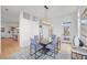 Elegant dining room with glass table, grey chairs, and hardwood floors at 731 Belt Se Loop, Atlanta, GA 30316
