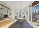 Spacious dining area with a large table, modern light fixture, and hardwood floors at 731 Belt Se Loop, Atlanta, GA 30316
