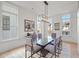 Elegant dining room with glass table, grey chairs, and hardwood floors at 731 Belt Se Loop, Atlanta, GA 30316