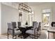 Modern dining room with glass-top table and gray chairs at 731 Belt Se Loop, Atlanta, GA 30316