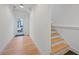 Bright hallway with hardwood floors, white walls, and access to the exterior at 731 Belt Se Loop, Atlanta, GA 30316