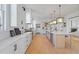 Modern kitchen with large island, stainless steel appliances, and white cabinetry at 731 Belt Se Loop, Atlanta, GA 30316