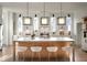 Modern kitchen with light wood island, white cabinets, and pendant lights at 731 Belt Se Loop, Atlanta, GA 30316