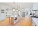 Modern kitchen with large island, stainless steel appliances, and white cabinetry at 731 Belt Se Loop, Atlanta, GA 30316