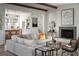 Open living room with white shiplap walls and a modern fireplace at 731 Belt Se Loop, Atlanta, GA 30316