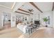Open living room with hardwood floors, white sectional sofa, and fireplace at 731 Belt Se Loop, Atlanta, GA 30316