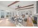 Open living space showcasing a sectional sofa, fireplace, and hardwood floors at 731 Belt Se Loop, Atlanta, GA 30316