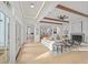 Spacious living room with hardwood floors, white sectional, and views to kitchen at 731 Belt Se Loop, Atlanta, GA 30316