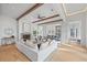 Bright and airy living room with hardwood floors, white sectional, and fireplace at 731 Belt Se Loop, Atlanta, GA 30316