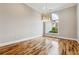 Bright dining room with hardwood floors and large window at 100 Dunwoody Creek Ct, Atlanta, GA 30350