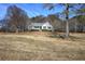 White single-story house on a large lot with trees at 857 Garner Rd, Rockmart, GA 30153