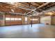 Unfinished basement garage, featuring double doors and high ceilings at 857 Garner Rd, Rockmart, GA 30153