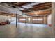 Spacious unfinished basement garage with large double doors and ample storage at 857 Garner Rd, Rockmart, GA 30153