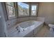 Luxurious bathroom featuring a large jetted tub at 857 Garner Rd, Rockmart, GA 30153